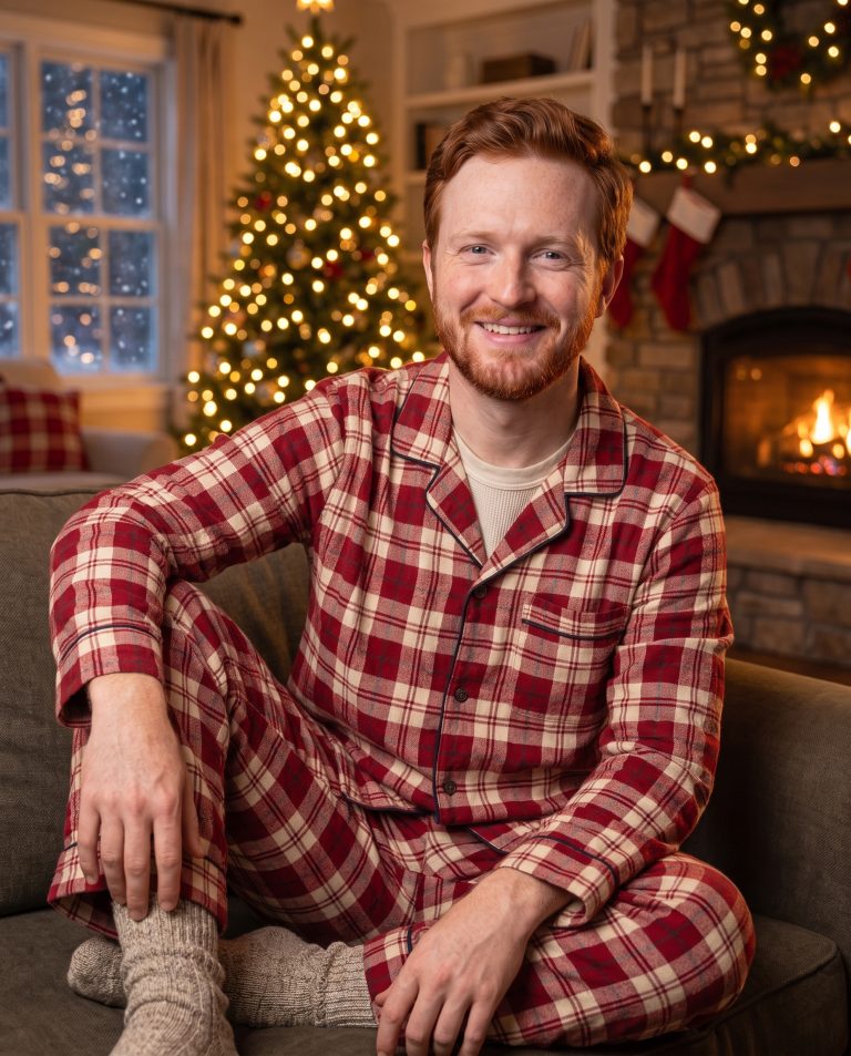 A guest sits or stands in a beautifully appointed living room on a winter evening.
