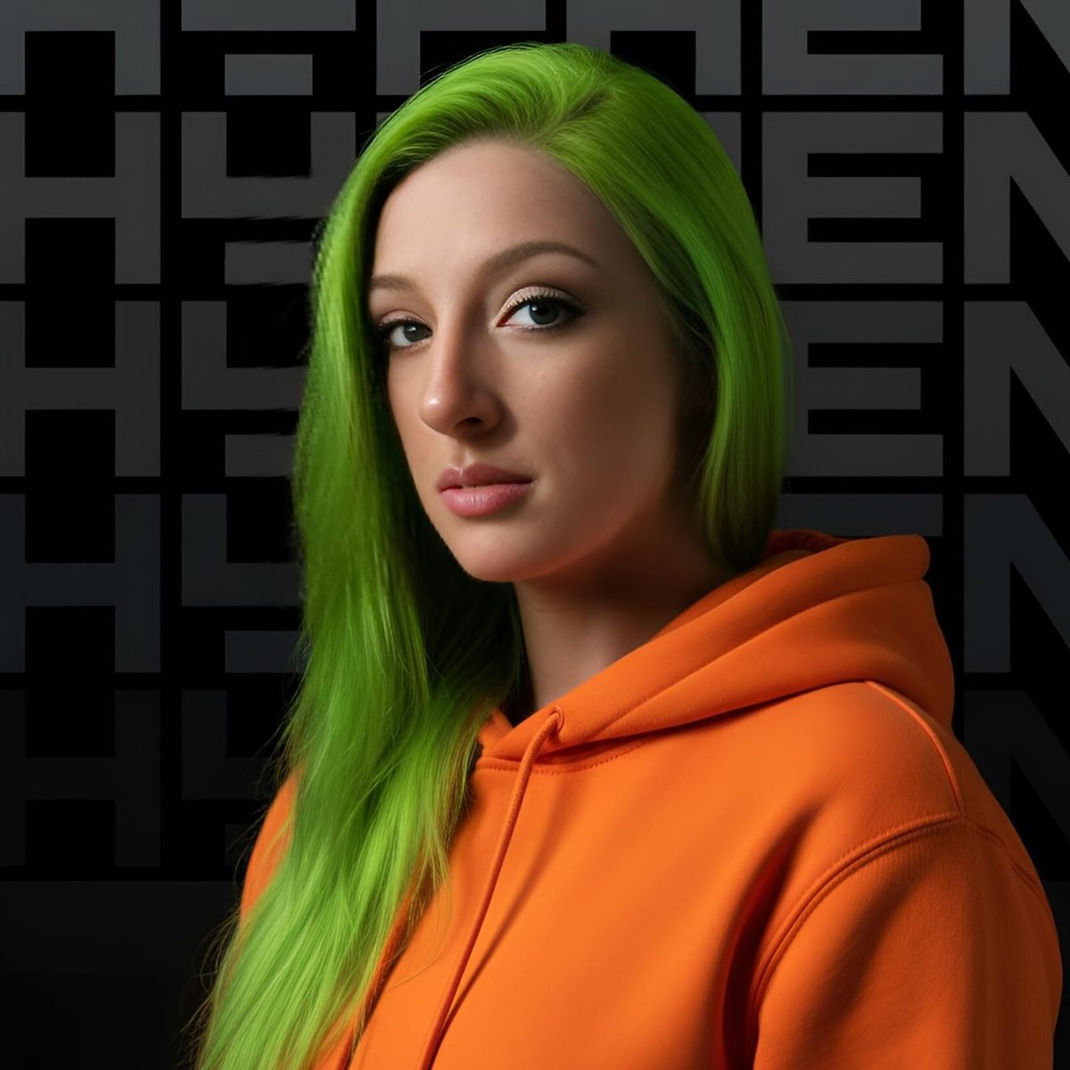 A guest restyled with lime-green hair and an orange hoodie in front of a dark wall of large repeating letters