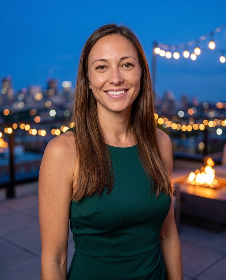 A guest stands on an open rooftop terrace high above a major city at blue hour.