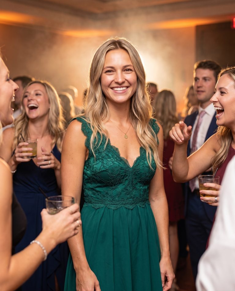 A guest stands calm and composed at the center of a packed party frozen in time.