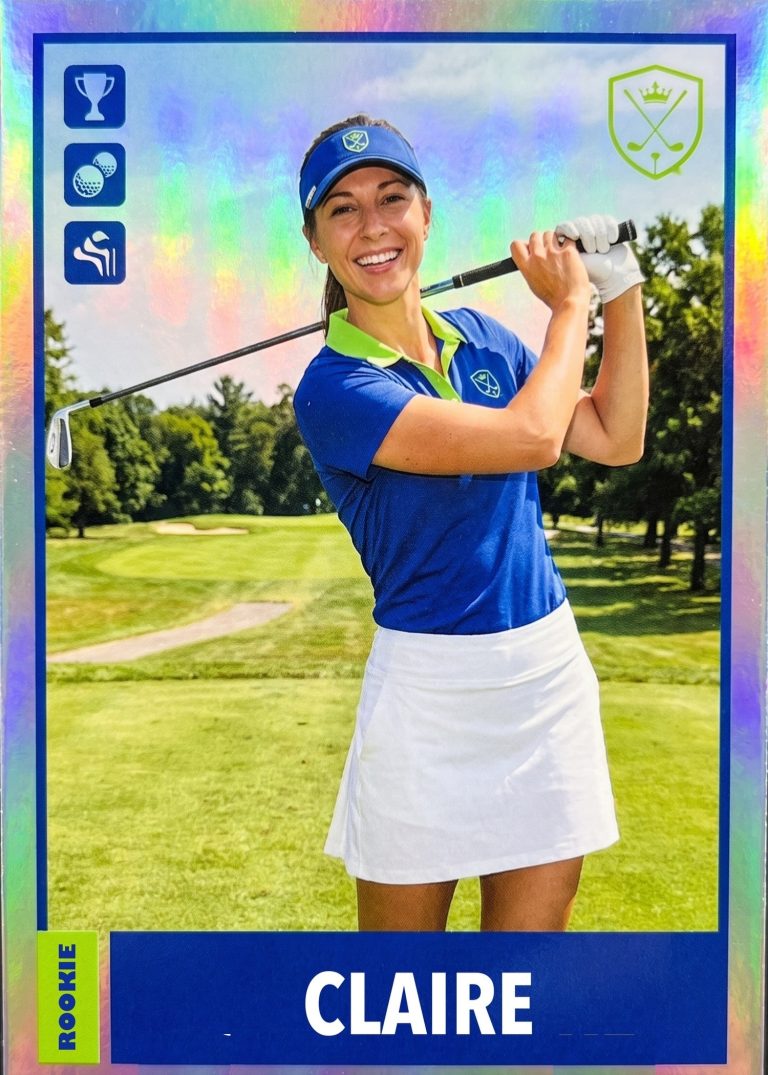A holographic golf card of a woman in a blue polo, white skirt and visor finishing a drive on a tree-lined fairway