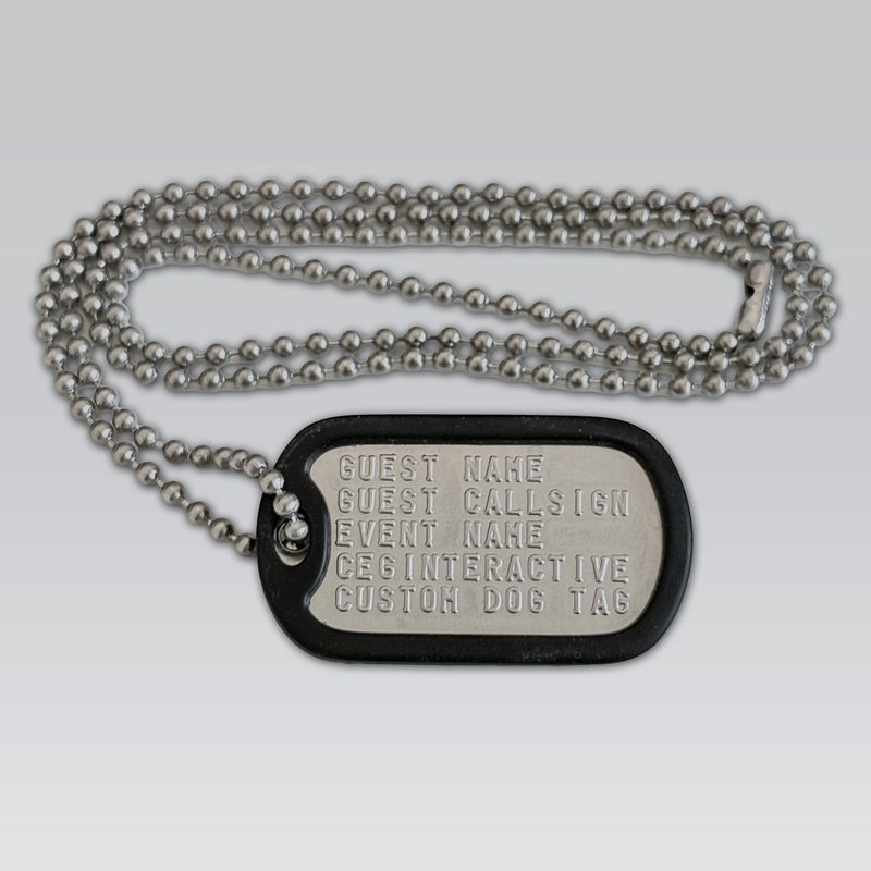 One embossed stainless steel sample dog tag in a black silencer on a ball chain against a gray background